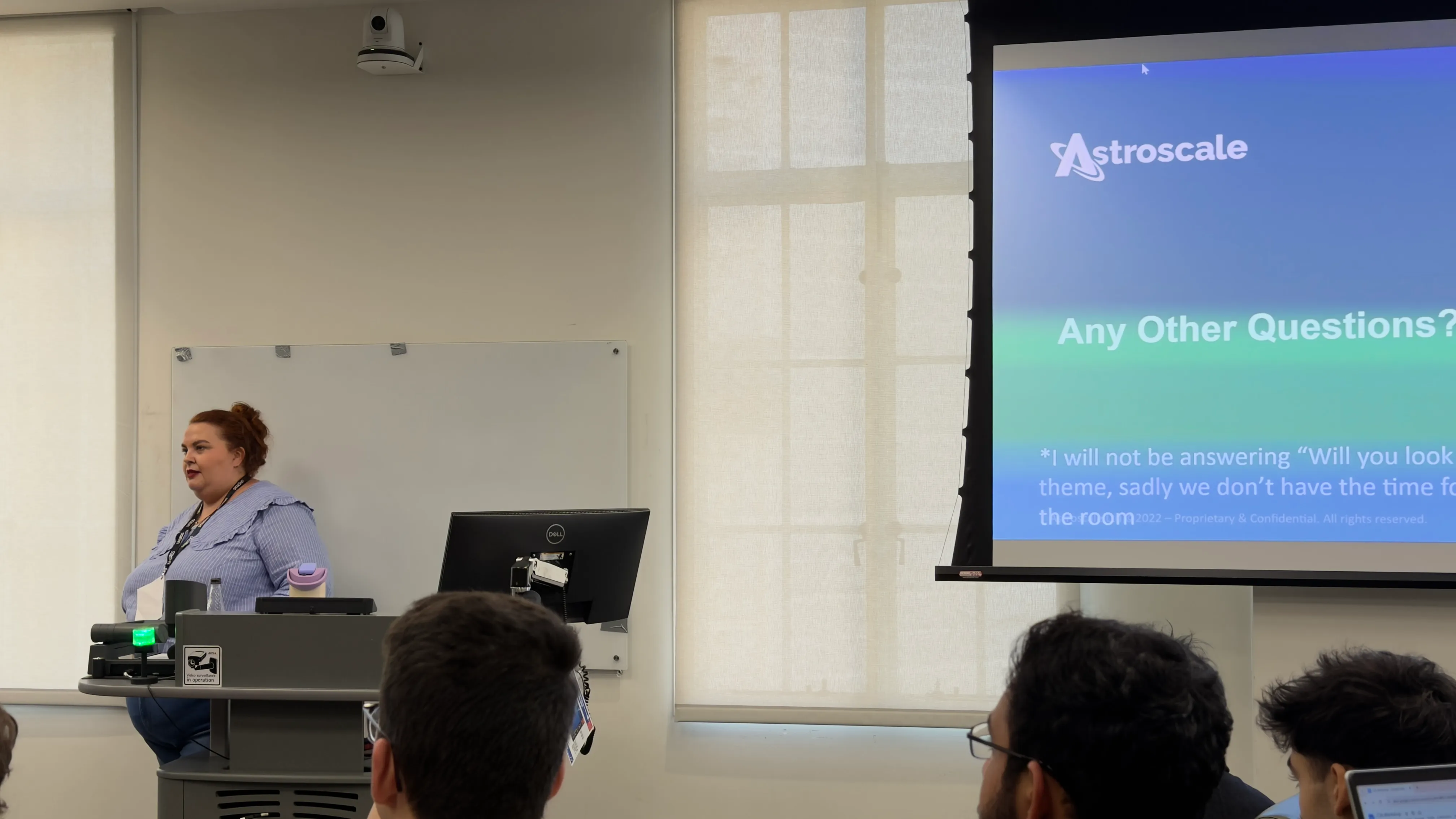 A photo from the CV workshop, showing the host next to a presentation.